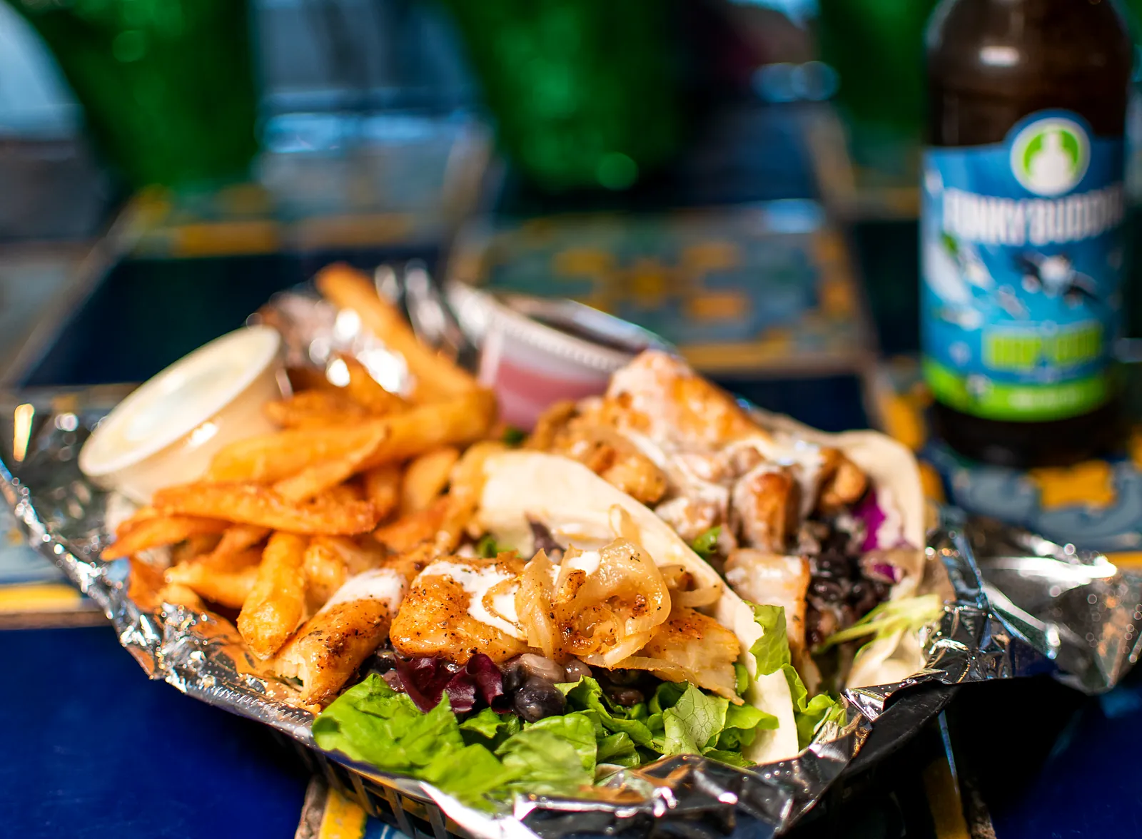 Tacos and fries in a foil basket